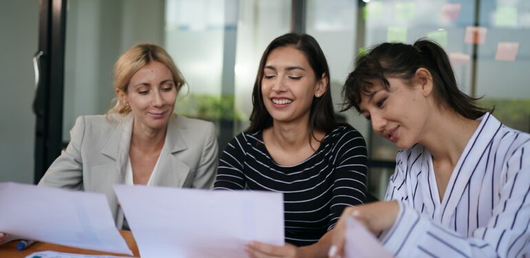 Businesswoman Making Business Presentation For Colleagues In Modern Office