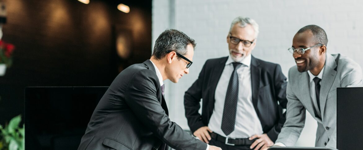 multiethnic businessmen discussing new business strategy on meeting in office