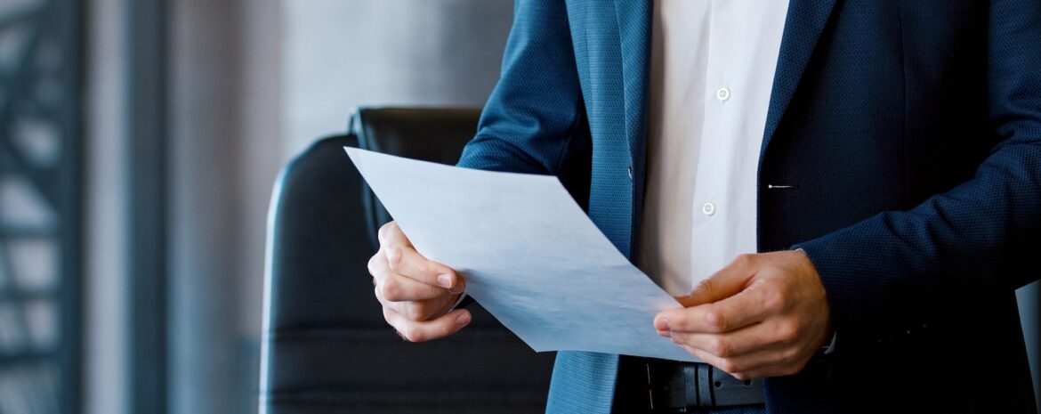 Young corporate leader in a suit at a business meeting