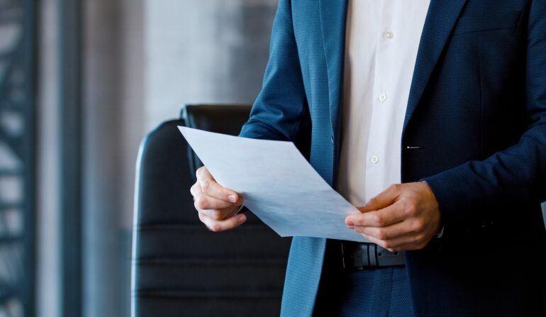 Young corporate leader in a suit at a business meeting